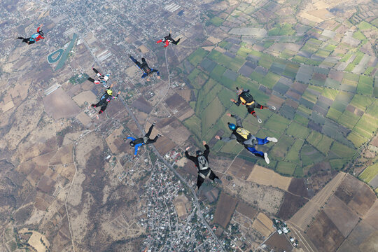 Extreme sport. Skydivers are falling in the sky.