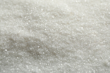 Pile of granulated sugar as background, closeup