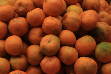 Fresh orange , lime or lemon for sale in local market which are place on stall.