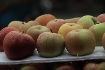 Closeup shot of fresh red and yellow apples