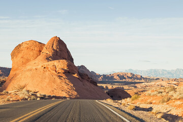 Big rock formation near the road. Highway in the Valley of Fire