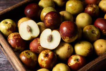 Chinese jujube or winter jujube on wooden table