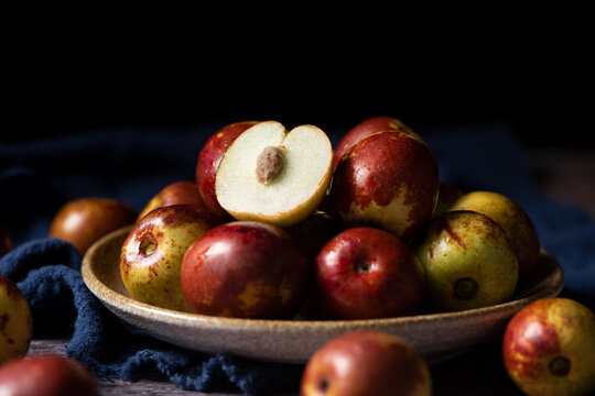 Chinese jujube or winter jujube on wooden table