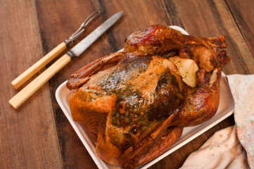 Crispy roast whole chicken on a plate