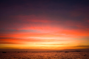 Sunset Colorful sunset at the sea. Romantic Sunet go down, blue and orange clouds flow in sky. Majestic summer landscape. Beautiful sky fluffy clouds evening day