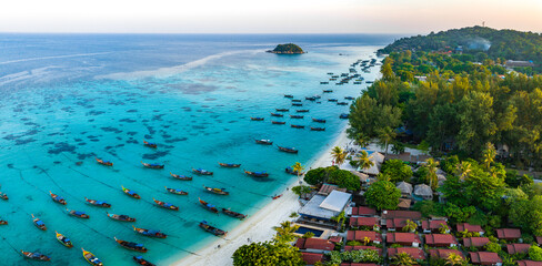 Aerial view of Sunrise beach with long tail boats in Koh Lipe, Satun, Thailand