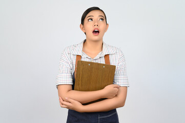 Portrait of young asian woman in waitress uniform pose with clipboard