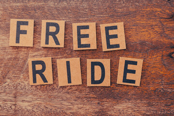Small wooden blocks forming the words free ride
