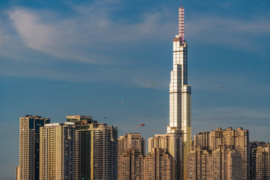 Ho Chi Minh City, Viet Nam 24 March 2022: Beautiful Sunset at Landmarks 81 Ho Chi Minh City, the tallest building in Vietnam, with Vietnam flag on the top building.