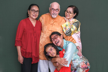 Family portrait in Chinese ethnic clothing to celebrate The New Lunar Year 2023