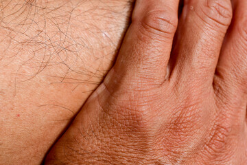 Human hand background, close-up, tanned skin