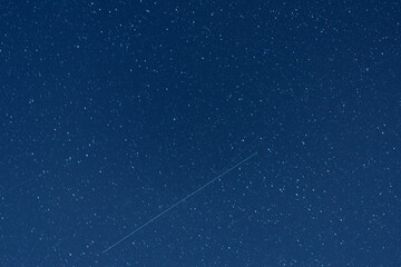 Quadrantids Meteor Shower 2023 The night sky traces of a falling meteorite. - 559064234