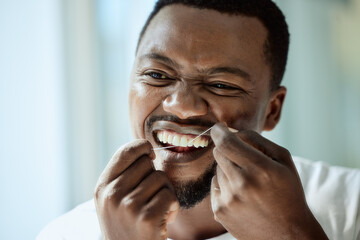 Health, beauty and teeth of black man with dental floss for morning oral hygiene routine with...