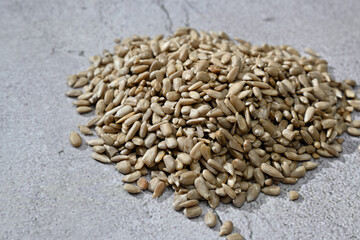 sunflower peeled seeds on a light background, macro