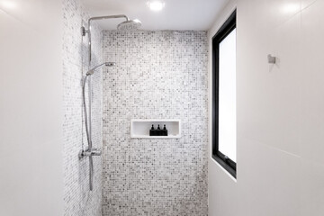 Shower rain and black pump bottle packaging mockup on shelf with grey tiles wall decoration and...