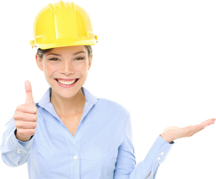 Engineer or architect woman. Portrait of beautiful female architect gesturing thumbs up while displaying product isolated in transparent PNG.