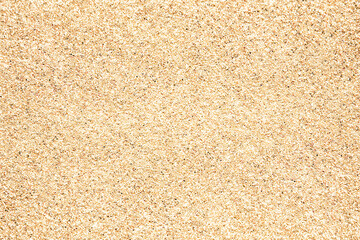 Fototapeta na wymiar Sand. Texture, surface of sea sand. Natural background. Close-up. View from above. Smooth. Copy space