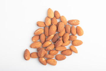 Heap of salted almonds on white background