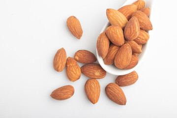 Salted almonds in a white cup.Copy space.
