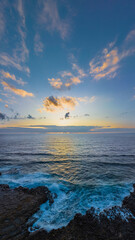 Sunrise over the ocean and rock platform