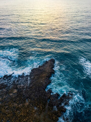 Sunrise over the ocean and rock platform