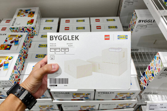 PENANG, MALAYSIA - APR 07, 2021: Hand holding LEGO IKEA BYGGLEK collection LEGO box with lid set in IKEA Batu Kawan Penang. IKEA and LEGO collboration