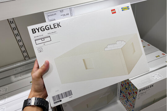 PENANG, MALAYSIA - APR 07, 2021: Hand holding LEGO IKEA BYGGLEK collection LEGO box with lid set in IKEA Batu Kawan Penang. IKEA and LEGO collboration