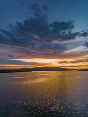 Fototapeta premium After the rain sunrise waterscape with clouds