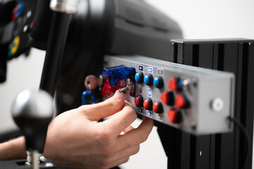 worker turning on the toggle switch up, industrial power control panel