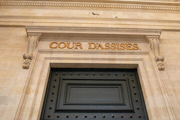 cour d'assises sign text on ancient wall facade building means in french courthouse assize court