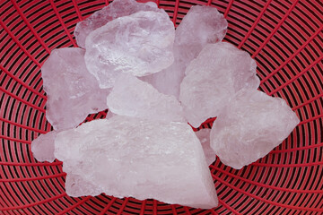 Crystal clear alum stones or Potassium alum on basket. Useful for beauty and spa treatment. Use to...