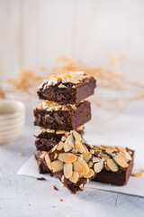 Almond Fudgy Brownies, brownies topped with almond nut.