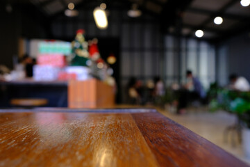 Close up Surface of Wooden Table in Cafe with Bokeh Background. (Selective Focus)