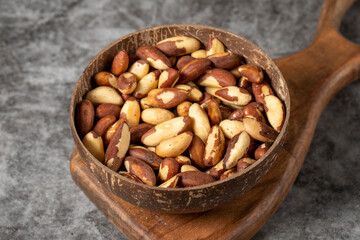 Brazil nut on dark background. Brazil nut in bowl. Studio shoot. close up