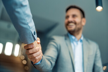 Business partners shaking hands,close up