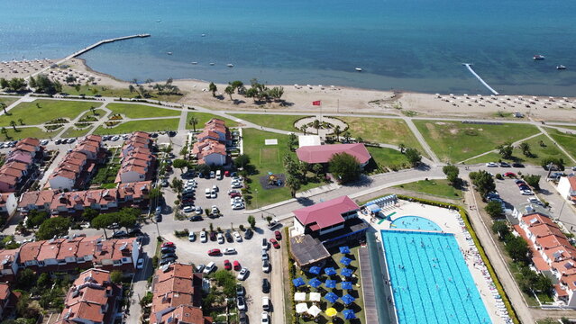Summerhouses, beach, sea and pool aerial view. Drone photo holiday, Turkey, Balıkesir.