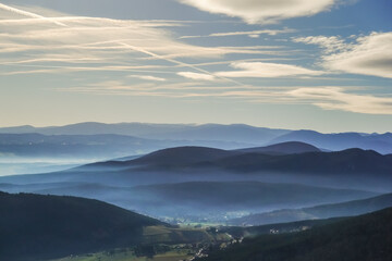 view to lot of mountains with fog in the valley during hiking
