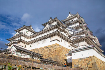The view of Himeji Castle in autumn, a hilltop Japanese castle complex. It is located in the Hyogo Prefecture of Japan,  one of the first UNESCO World Heritage Sites.