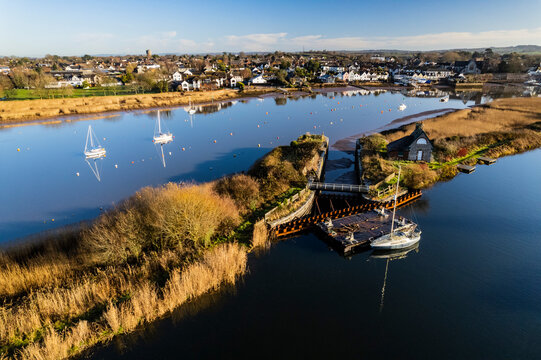 Aerial shot of River Exe and Topsham town with boats and lock in Devon, UK