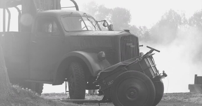 German World War Ii Automotive. German Military Ammunition. German Vehicle Truck Opel Blitz And German Infantry Cart Or Handcart Infanteriekarren If8 Of World War Ww Ii. Black And White Video.