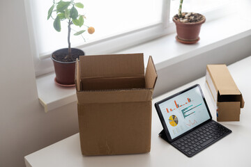 tablet computers. Online products to prepare product boxes with graph business diagram, idea, creativity, and finance strategy concept.