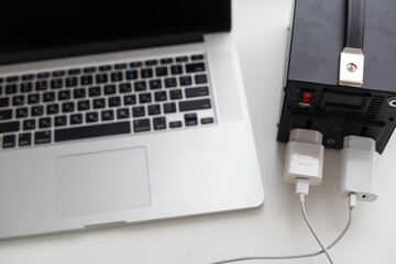 Charging station for phone, tablet, laptop and other gadgets when there is no light during...