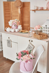 White kitchen interior. Crockery and kitchen utensils