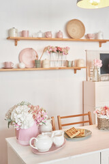 White kitchen interior. Crockery and kitchen utensils
