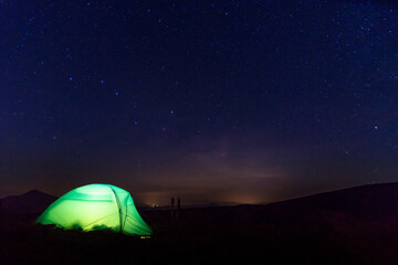 Fototapeta na wymiar Hiking tent in the starry night.