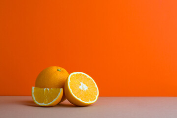 A front view of citrus in orange background