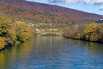 Beautiful autumn landscape with bridge over Aare River in the background at Swiss City of Olten on a sunny autumn day. Photo taken November 10th, 2022, Olten, Switzerland.