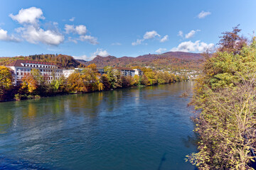 Beautiful autumn landscape with bridge over Aare River in the background at Swiss City of Olten on a sunny autumn day. Photo taken November 10th, 2022, Olten, Switzerland.