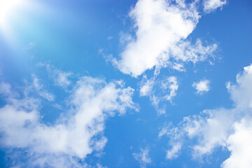 Obraz premium Abstract background. Natural background. The sun's rays. Blue sky with white clouds. Copy space