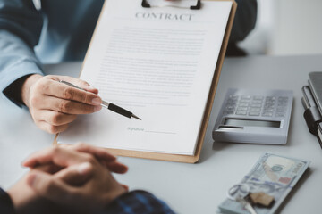 Real estate agents explain models of housing estates in projects to elaborate to clients, explaining and presenting information about homes and purchasing loans. Real estate trading concept.